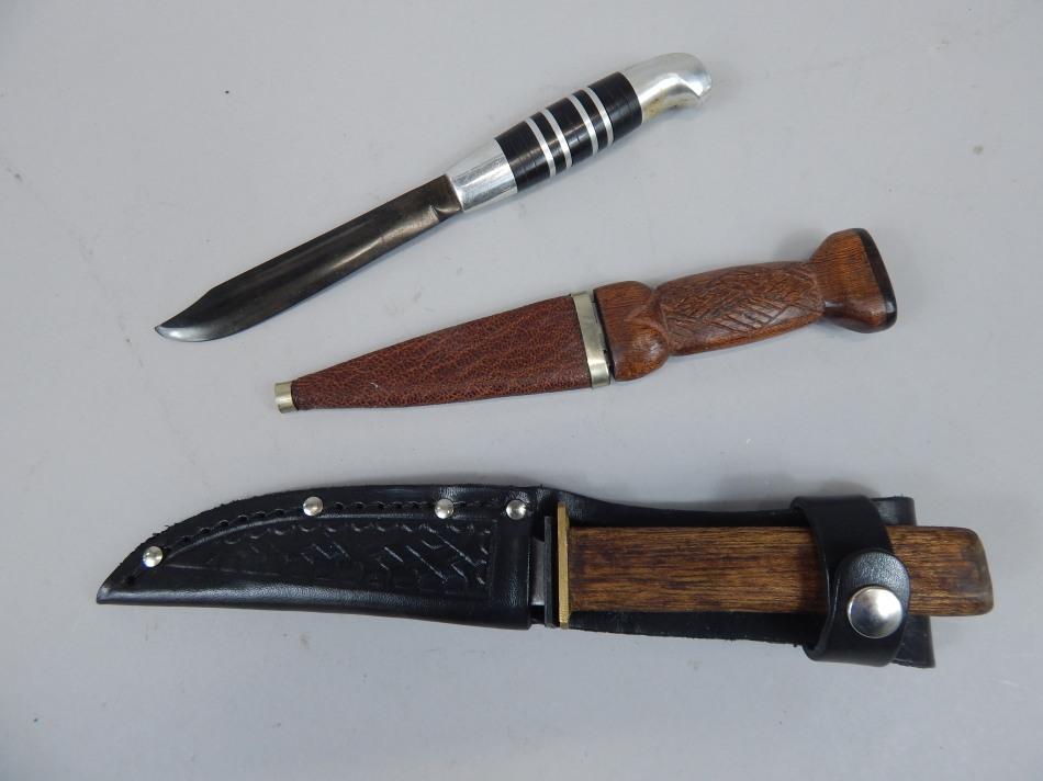 Appraisal: Three knives to include a Bowie type knife with aluminium