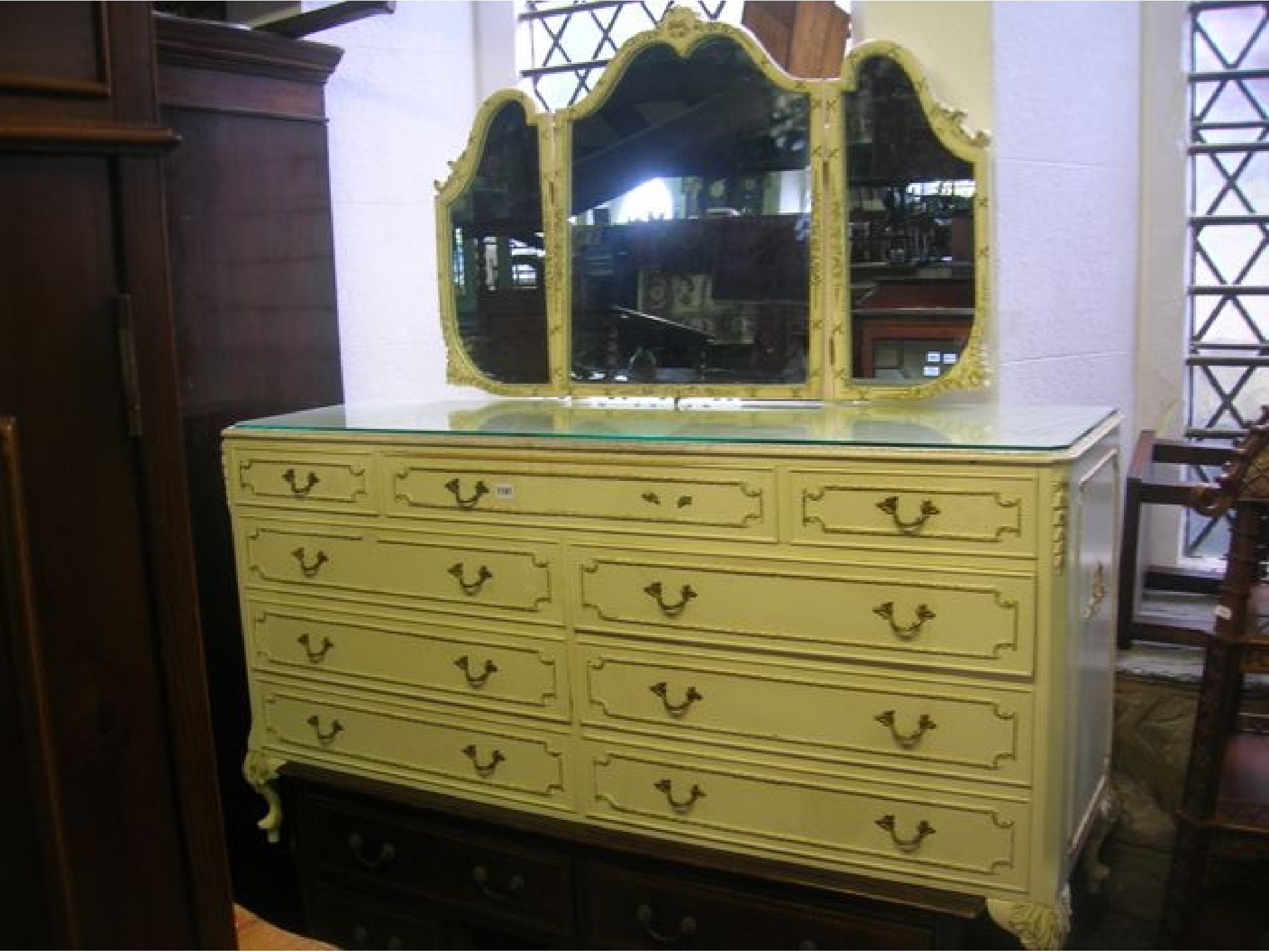 Appraisal: A whitewood bedroom chest fitted with an arrangement of nine