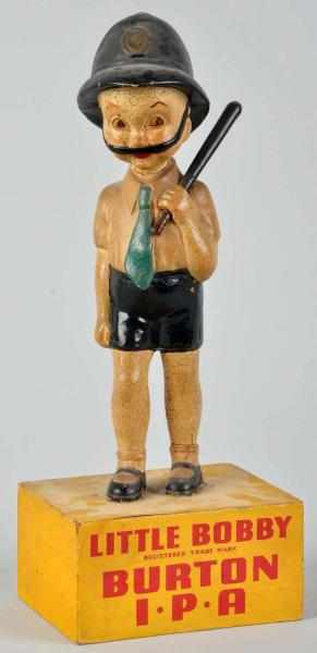 Appraisal: Little Bobby Burton IPA Advertising Figure s Rubberoid and wood