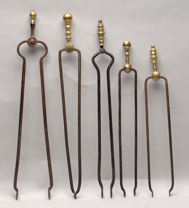 Appraisal: FIVE PAIR OF FIREPLACE TONGS Each having a turned brass