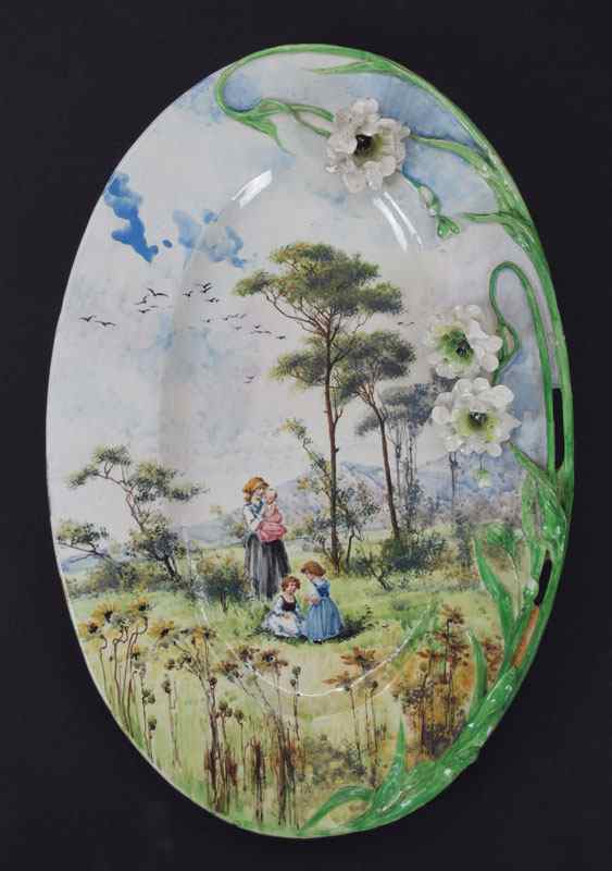 Appraisal: FRENCH FAIENCE CHARGER PLAQUE Hand painted with scene of mother