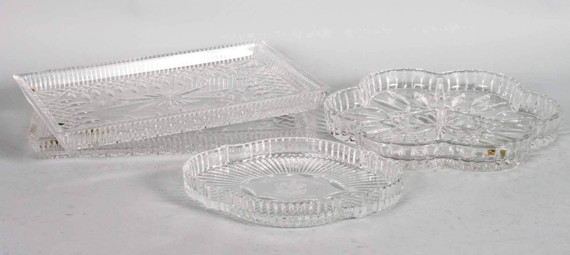 Appraisal: a Four Waterford crystal trays including shaped three-section tray Waterford