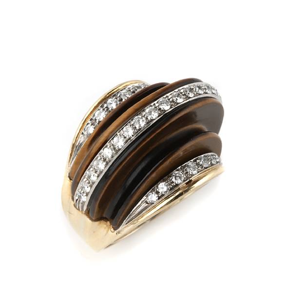 Appraisal: A diamond carved tiger's eye and white and yellow gold