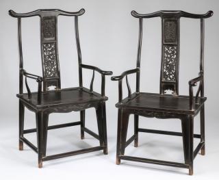 Appraisal: Chinese carved 'official's hat' armchairs Pair of Chinese carved yoke-back