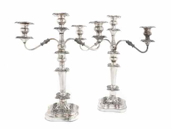 Appraisal: A Pair of Sheffield Plate Three-Light Candelabra having repousse bobeches