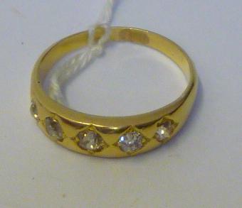 Appraisal: A DIAMOND BAND RING the upper section gypsy set with