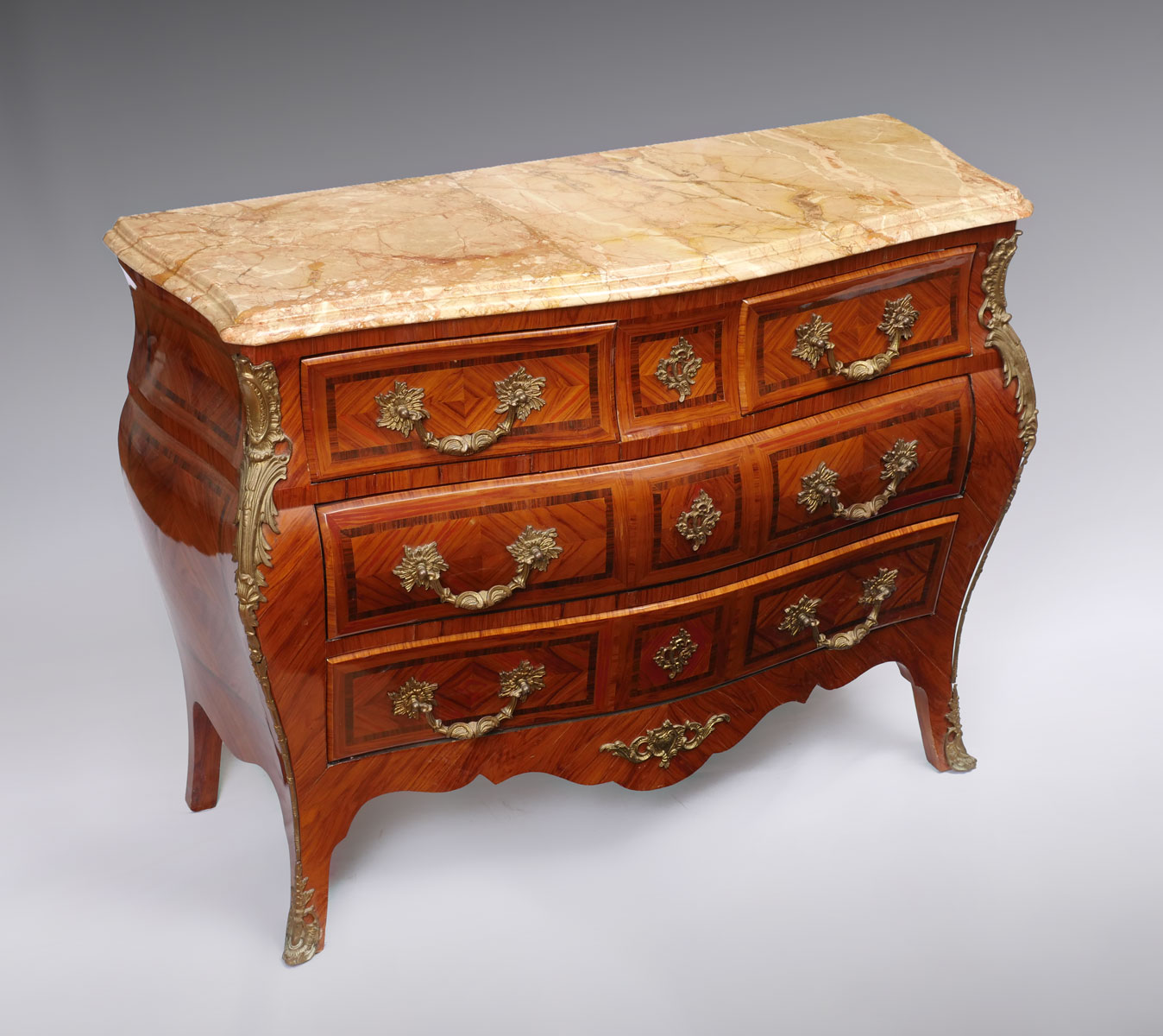 Appraisal: MARBLE TOP BOMBE COMMODE Bombe commode having a surmounting beveled