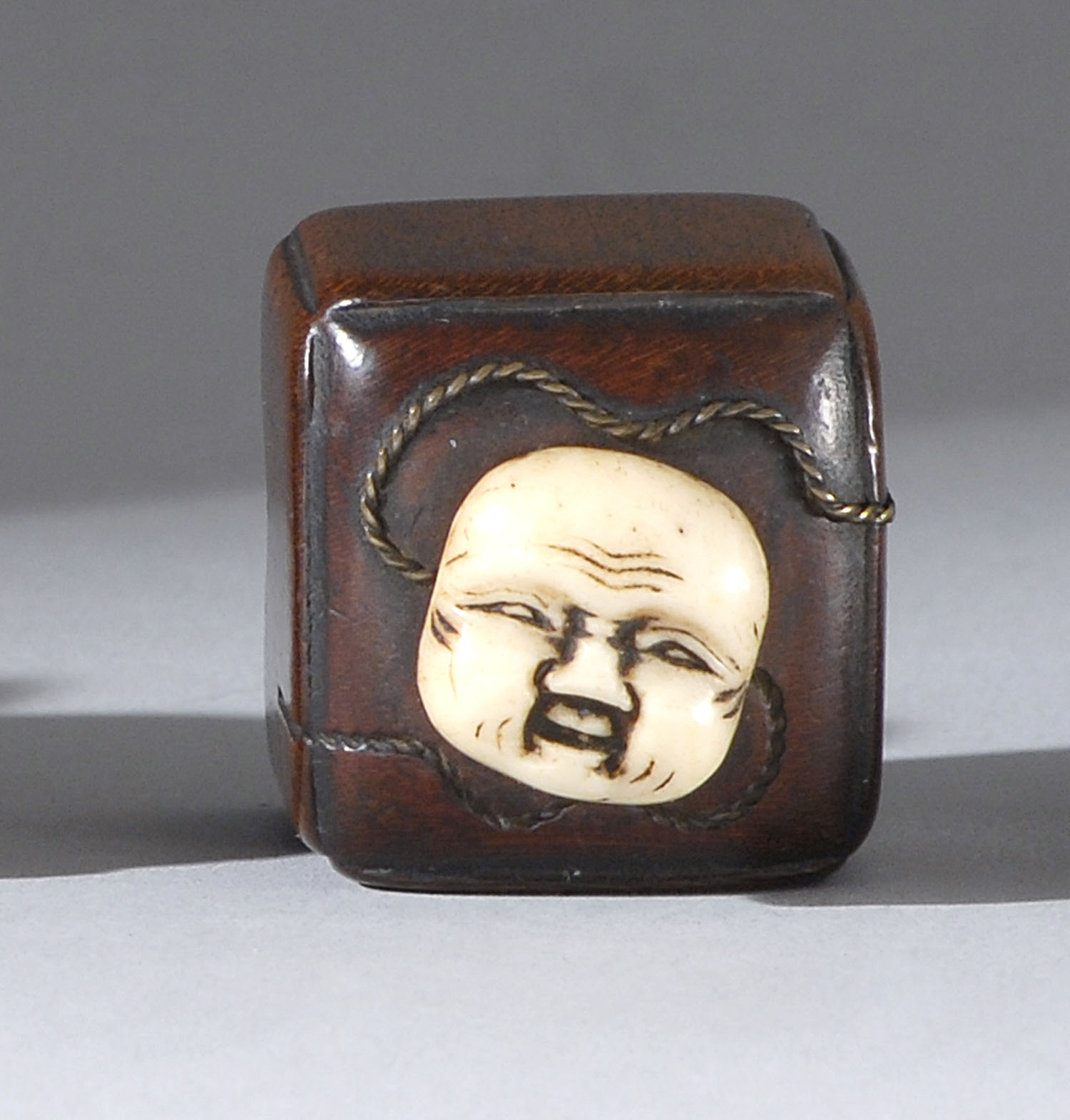 Appraisal: WOOD AND STAGHORN NETSUKE th CenturyIn the form of a