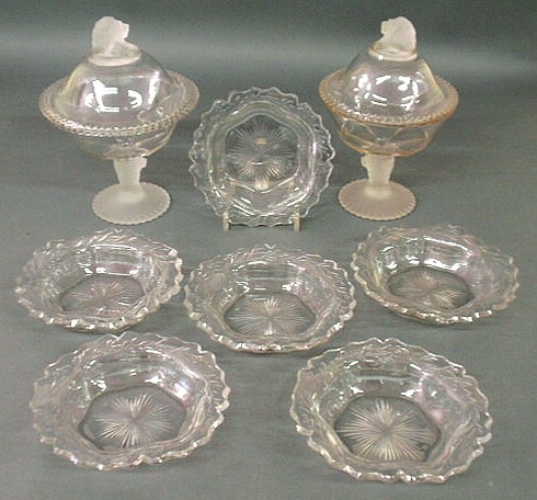 Appraisal: Two similar pressed glass compotes with frosted glass lion finials