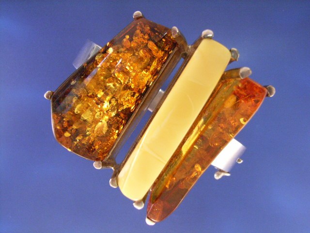 Appraisal: A contemporary sterling silver amber bangle inner diameter x mm