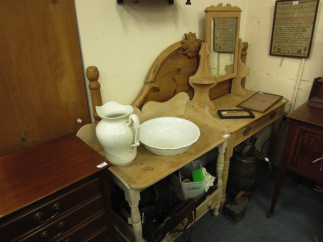 Appraisal: A VICTORIAN PINE DRESSING TABLE with raised mirrored back single