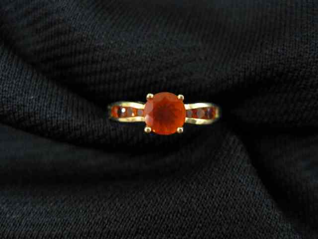 Appraisal: Fire Opal Ring carat fiery orange gem with four smaller