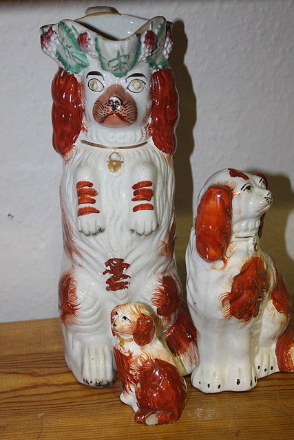 Appraisal: A STAFFORDSHIRE BEGGING DOG with tricorn hat circa cm high