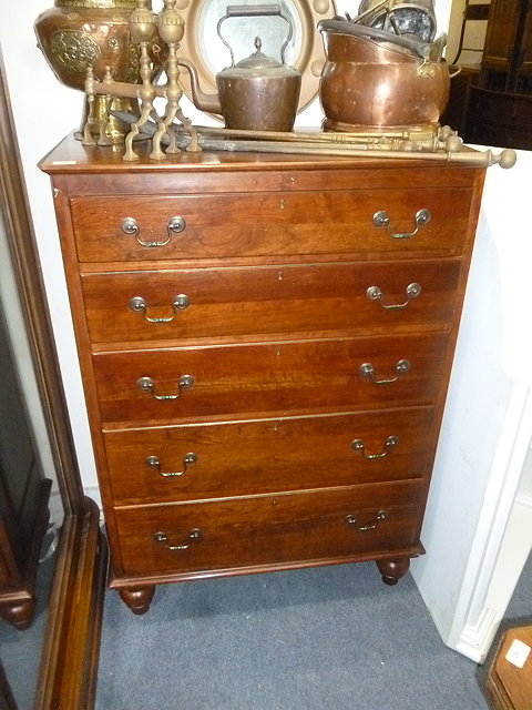 Appraisal: A MODERN HARDWOOD CHEST of five drawers with panelled sides