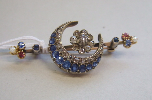 Appraisal: A sapphire diamond ruby and pearl brooch designed as a