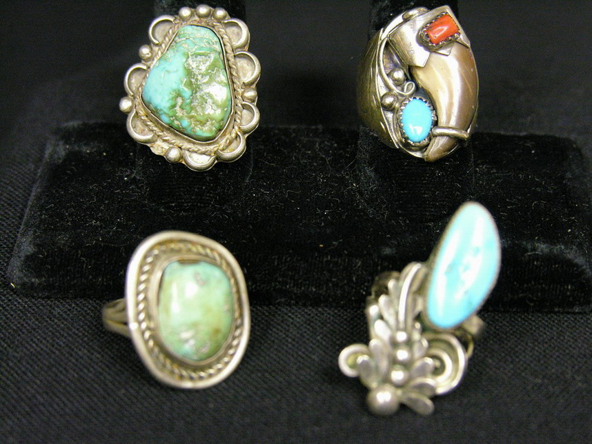 Appraisal: FOUR STERLING AND TURQUOISE RINGS Ring with claw signed -