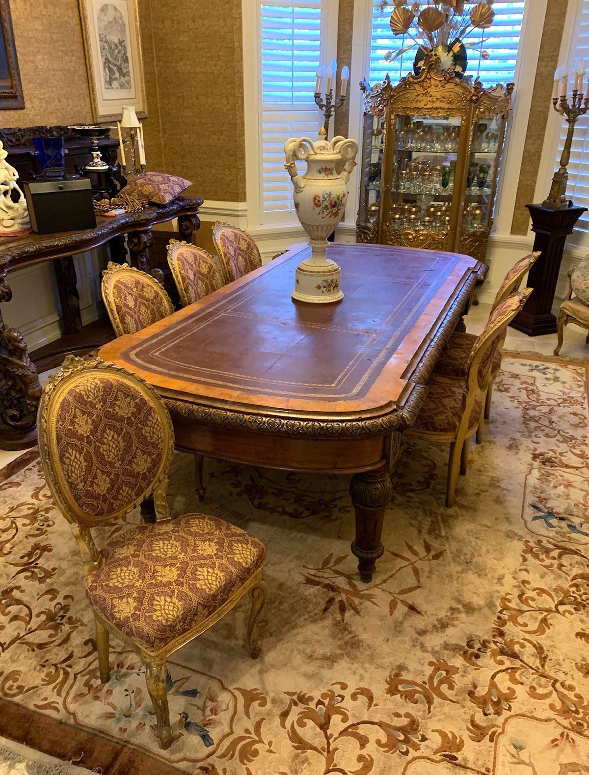 Appraisal: TH C CARVED POLLARD OAK LIBRARY TABLE Shaped gold embossed