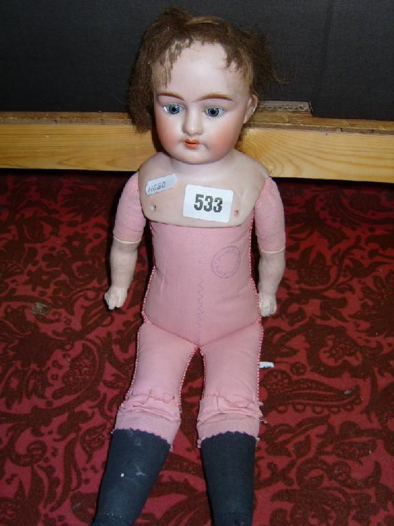 Appraisal: A German bisque headed doll with closing grey eyes and