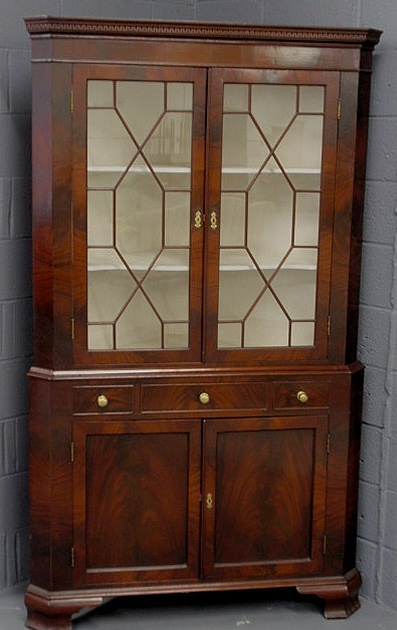 Appraisal: Mahogany two-piece corner cabinet late th early th c with