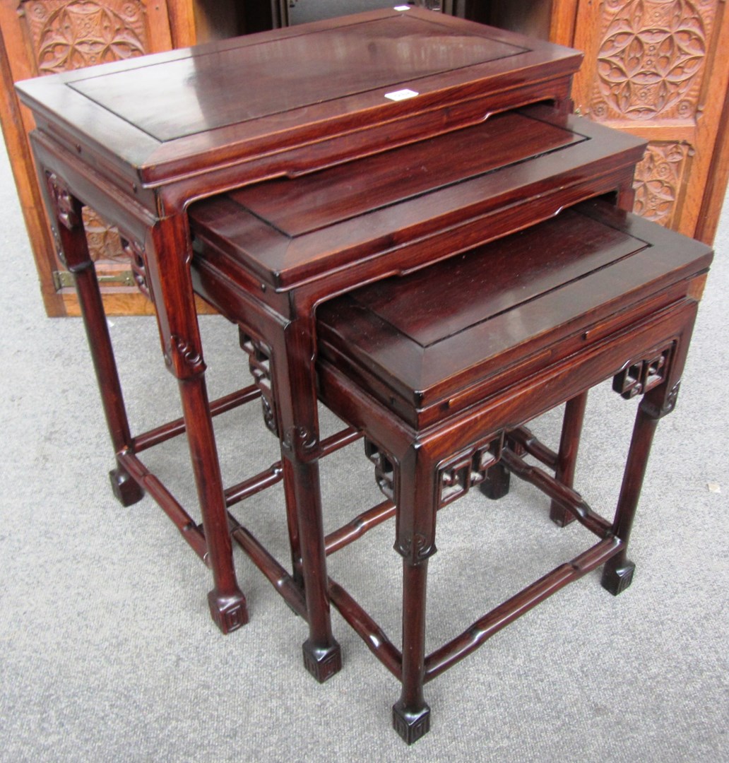 Appraisal: A nest of three Chinese hardwood occasional tables with carved