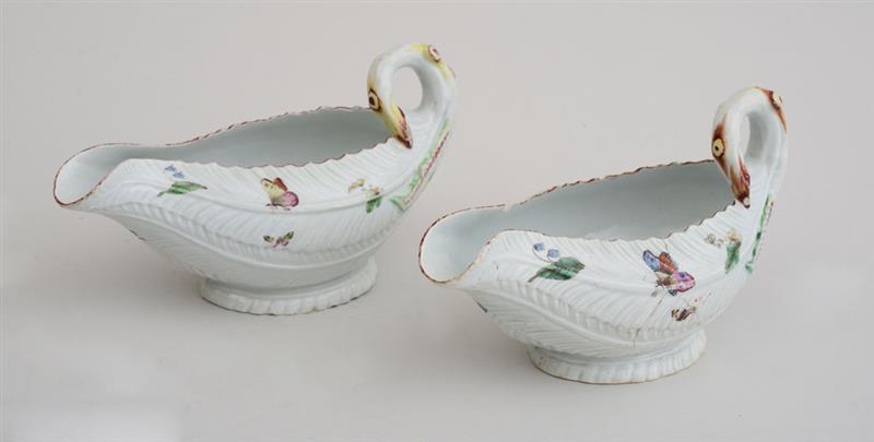 Appraisal: PAIR OF WORCESTER LEAF-MOLDED PORCELAIN SAUCEBOATS Each modeled with overlapping