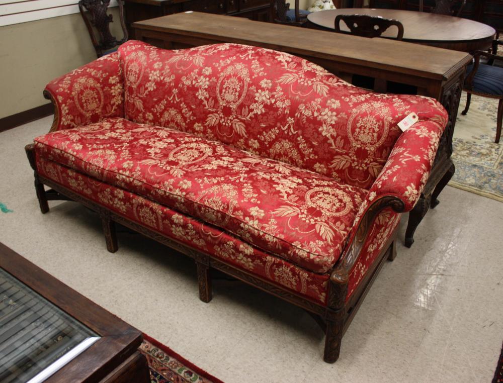 Appraisal: CHIPPENDALE STYLE SOFA cream on red brocade upholstery carved mahogany