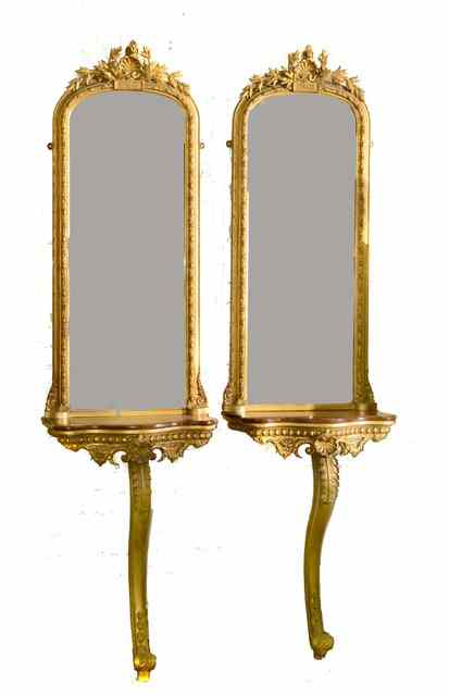 Appraisal: A PAIR OF VICTORIAN GILTWOOD CONSOLE TABLES each with pier