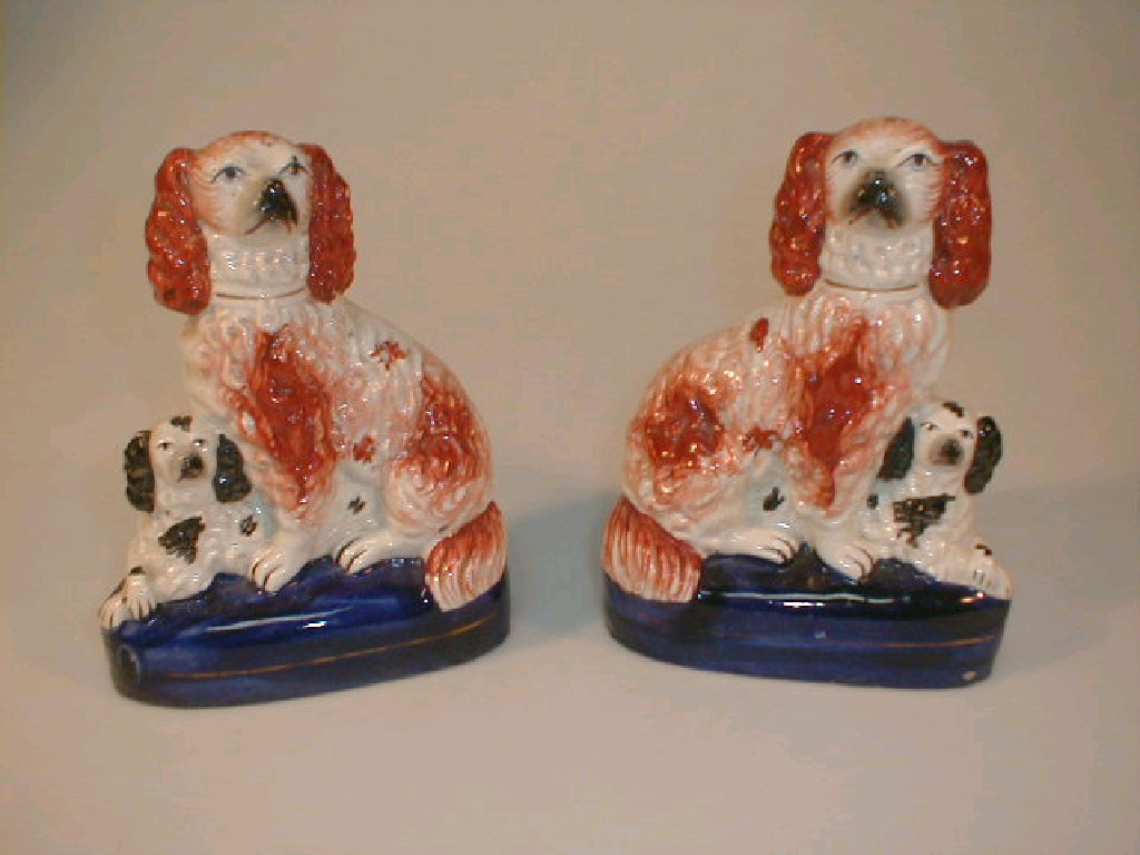 Appraisal: A pair of thC Staffordshire figure groups of spaniels on