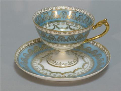 Appraisal: SERVES PORCELAIN CUP AND SAUCER Pale and wreath design