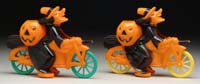 Appraisal: PAIR OF PLASTIC WITCHES ON MOTORCYCLES Both bikes are orange