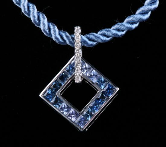 Appraisal: K WHITE GOLD BLUE SAPPHIRE AND DIAMOND PENDANT Openwork square