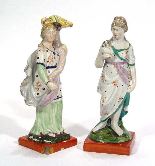 Appraisal: Two early th Century Staffordshire pearlware figures a woman clutching