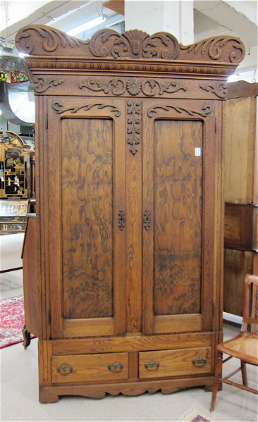 Appraisal: LATE VICTORIAN OAK WARDROBE American c having a carved crest