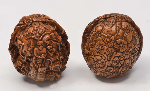 Appraisal: A JAPANESE CARVING on a natural walnut shell worked as