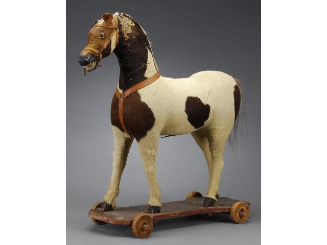 Appraisal: Horse on Wheeled Platform America ca Hide covered wood horse