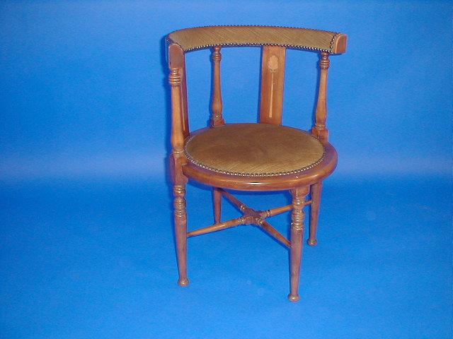 Appraisal: An Edwardian beech marquetry circular chair on turned legs