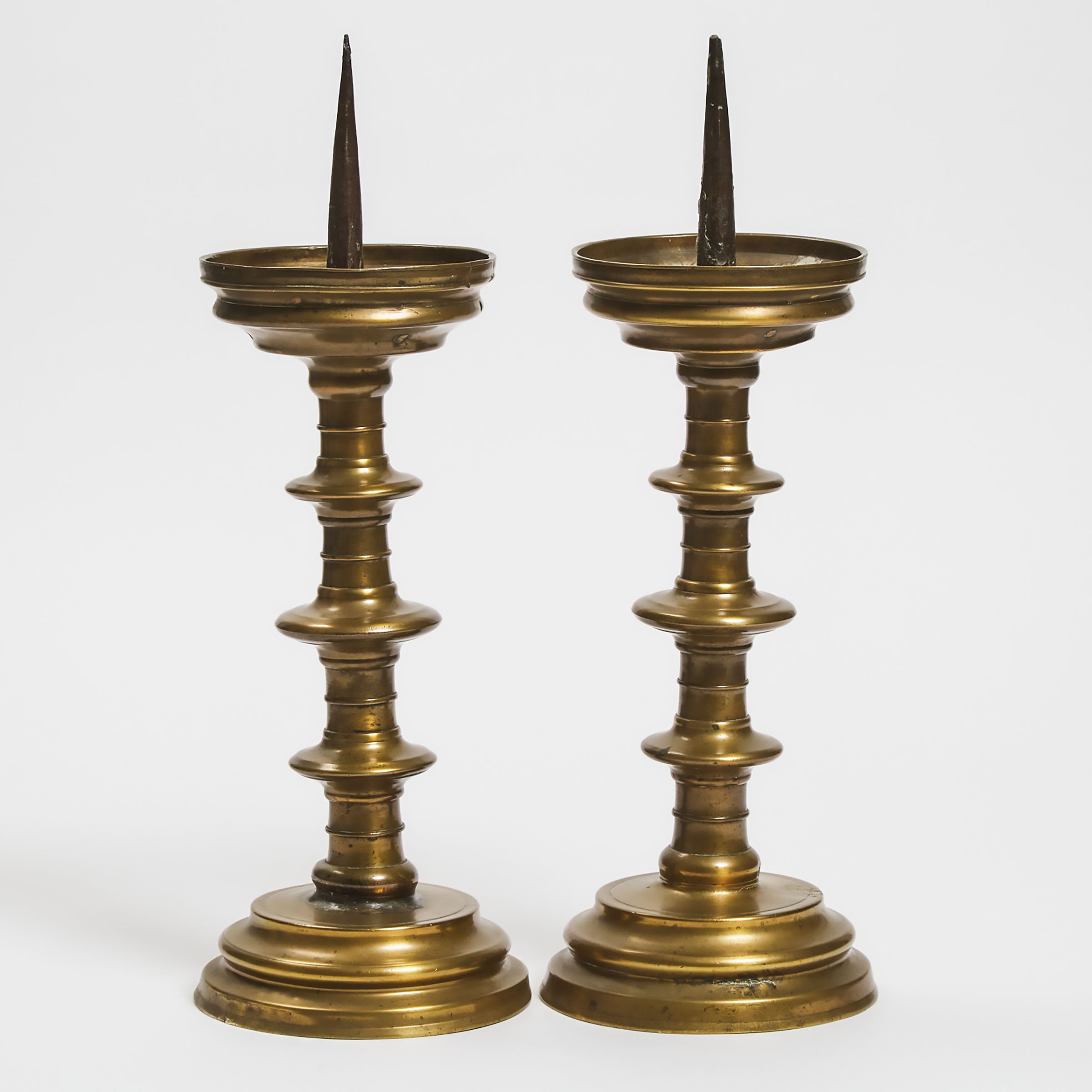 Appraisal: Pair of North European Gothic Turned Brass Pricket Altar Sticks