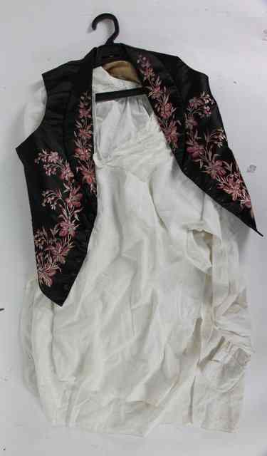 Appraisal: A black satin waistcoat finely embroidered flowers in pink and