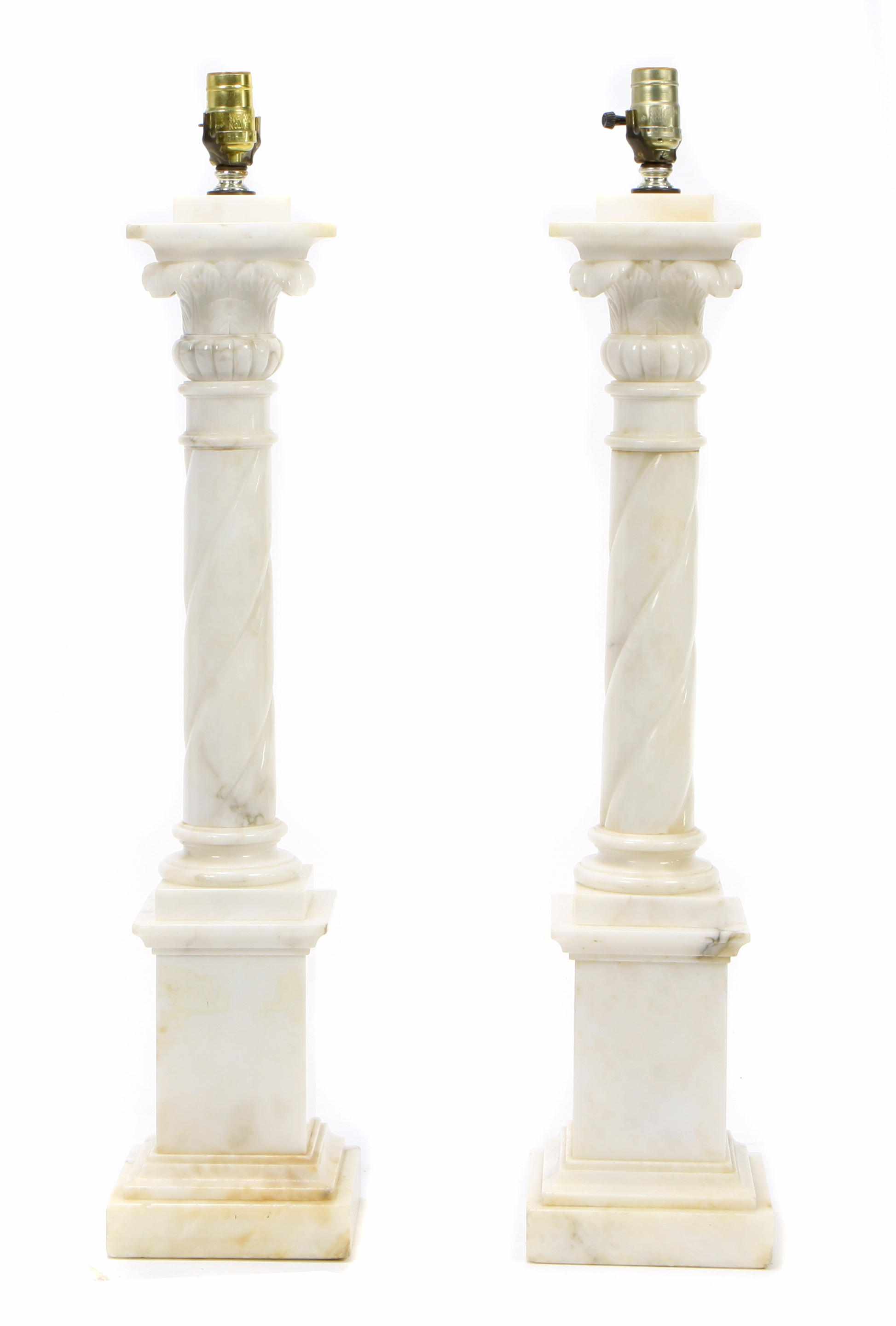 Appraisal: A pair of Neoclassical style carved alabaster column form lamps