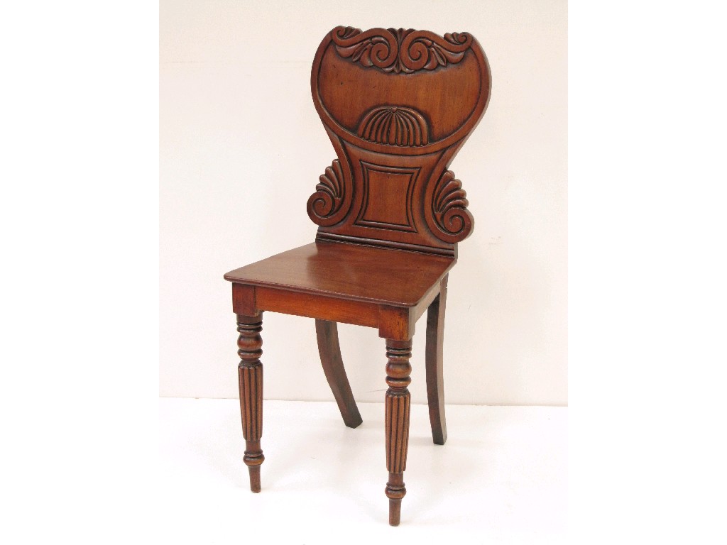 Appraisal: A Victorian mahogany Hall Chair with carved back on reeded