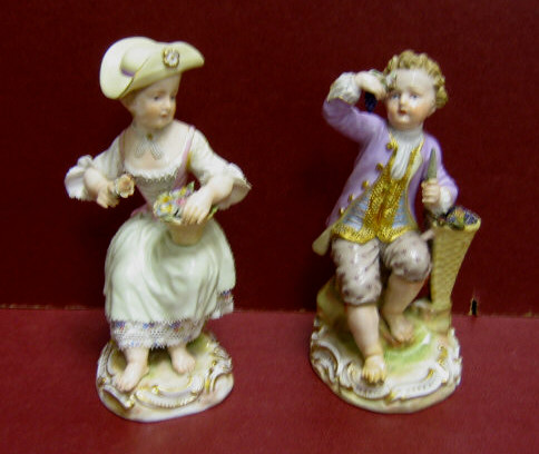 Appraisal: PAIR OF MEISSEN PORCELAIN FIGURINES Of a seated boy with