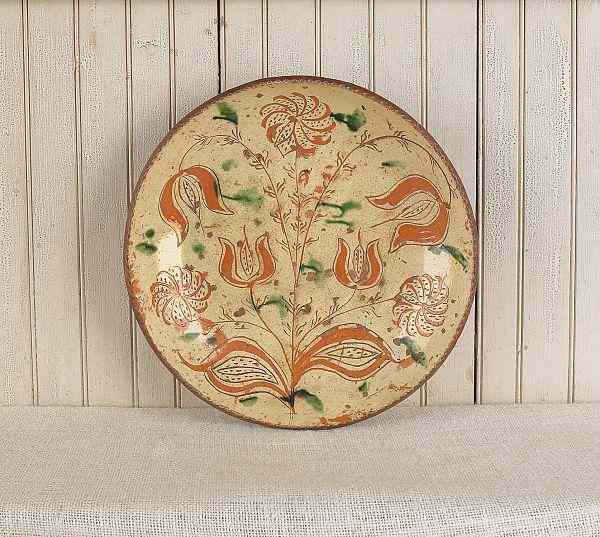 Appraisal: Bucks County Pennsylvania sgraffito redware charger ca with tulip and