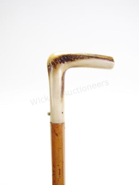 Appraisal: Antler Sword Cane solid wood shaft antler handle reveals star