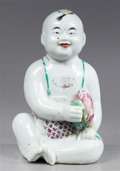 Appraisal: Chinese porcelain baby sculpture holding a blossom overall good condition