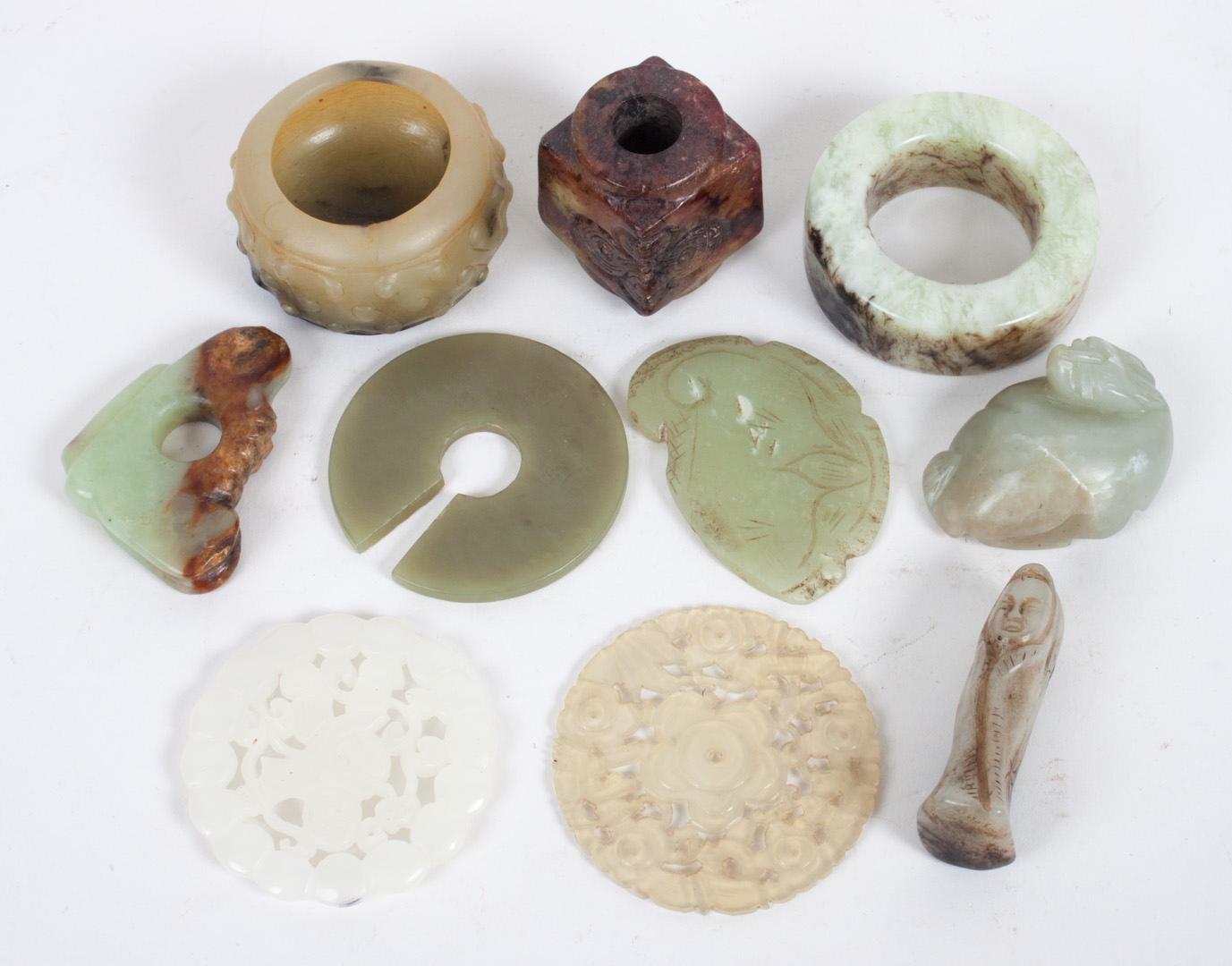 Appraisal: assorted Chinese carved jade objects items include amulets pi rings