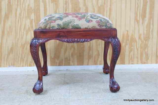 Appraisal: Carved Mahogany Large Stool Ornately detailed with a thick cushioned