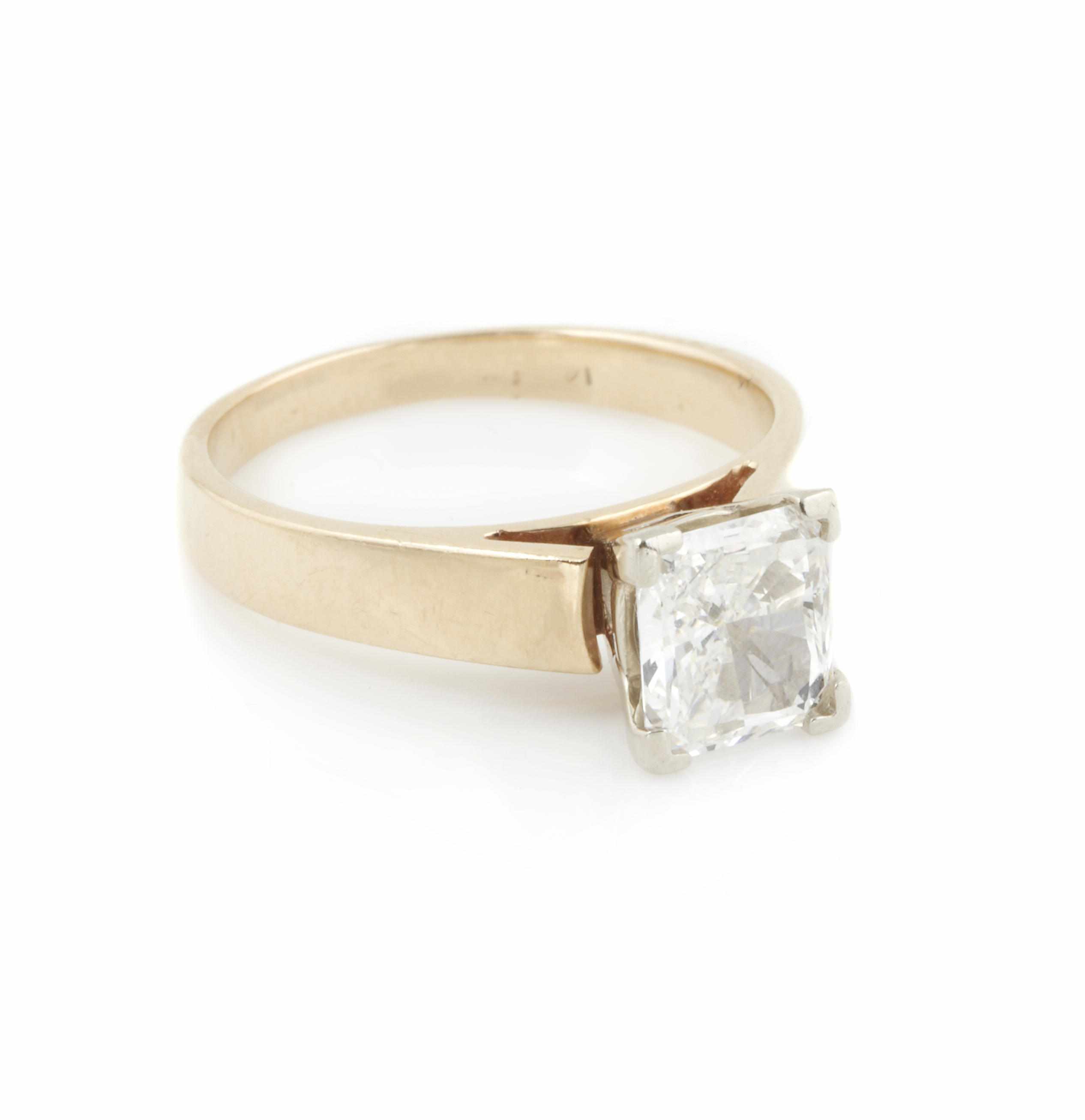 Appraisal: A diamond and k gold ring centering a square-cut diamond