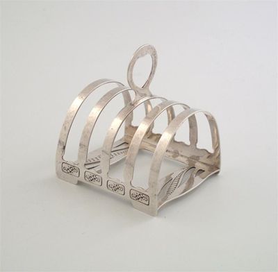 Appraisal: By Liberty Co a modern small toast rack with chased