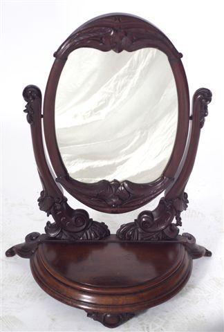 Appraisal: VICTORIAN MAHOGANY TOILET MIRROR the oval plate within a conforming