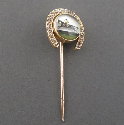 Appraisal: A nineteenth century reverse carved crystal jockey and horse pin